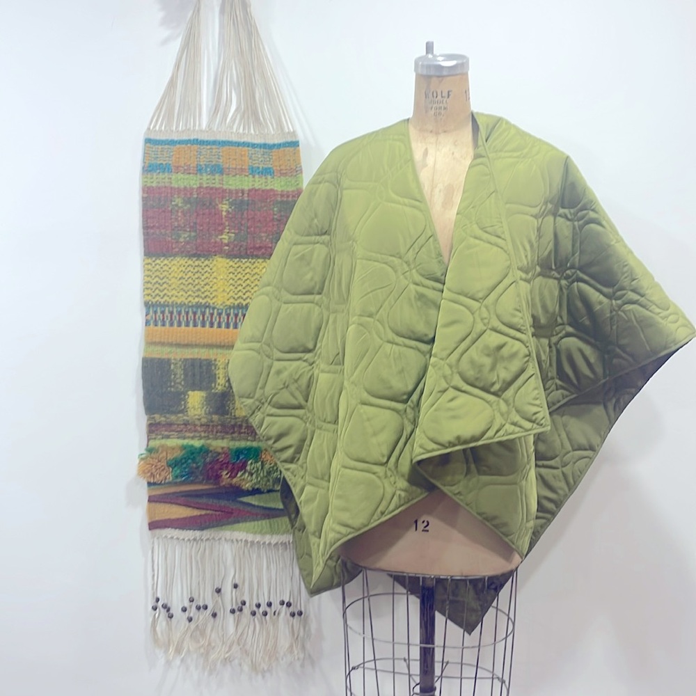 House of Harlow wrap/cocoon/kimono type shawl. 100% nylon. Light quilting.